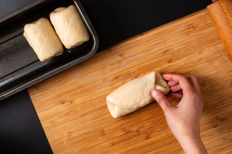 Food Baking concept Making organic homemade soft milk loaf bread in loaf pan on wooden board with copy space