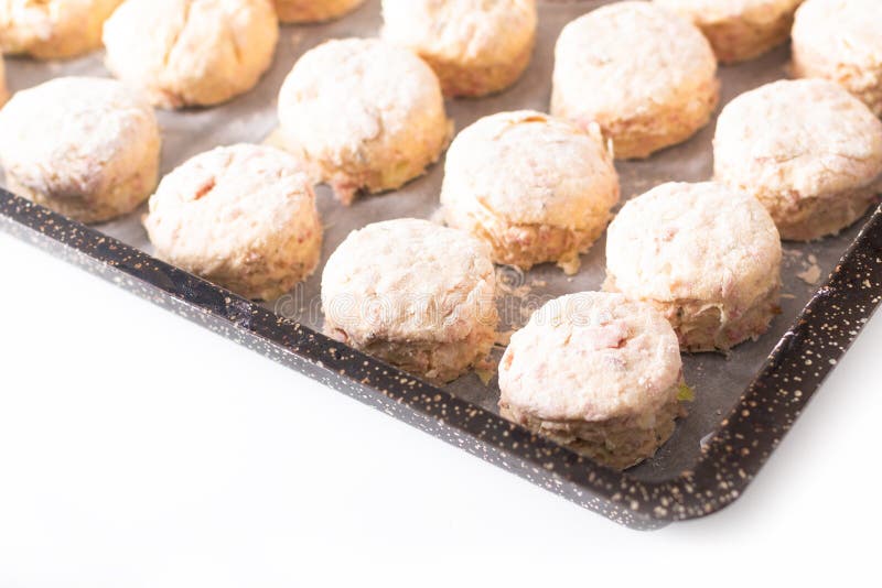 Food concept dough of Homemade buttery, salty Ham and cheese scones before baking on white background stock images Food concept dough of Homemade buttery, salty Ham and cheese scones before baking on white background stock images