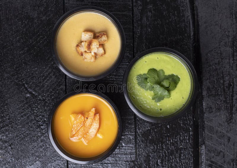 Lunch Boxes With Avacado, Pumpkin, Pea Soup, Carrot And Pepper On Kitchen Board, Place For Text, Healthy Meal In Food Containers