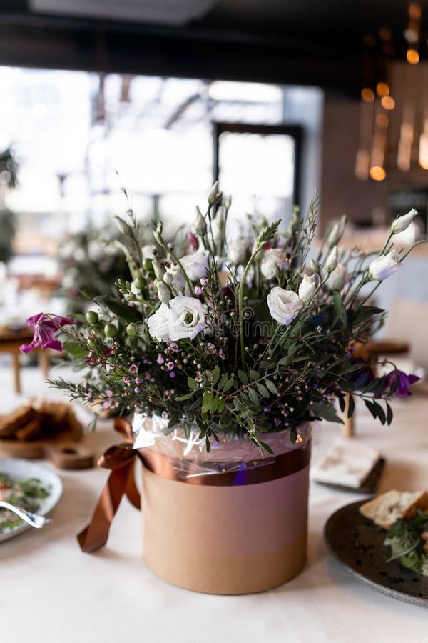 Food and Decoration of Flowers on a Festive Table in a Restaurant Stock