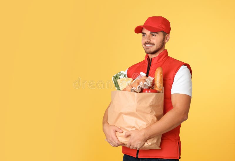 Food Delivery Courier Holding Paper Bag With Products On Color