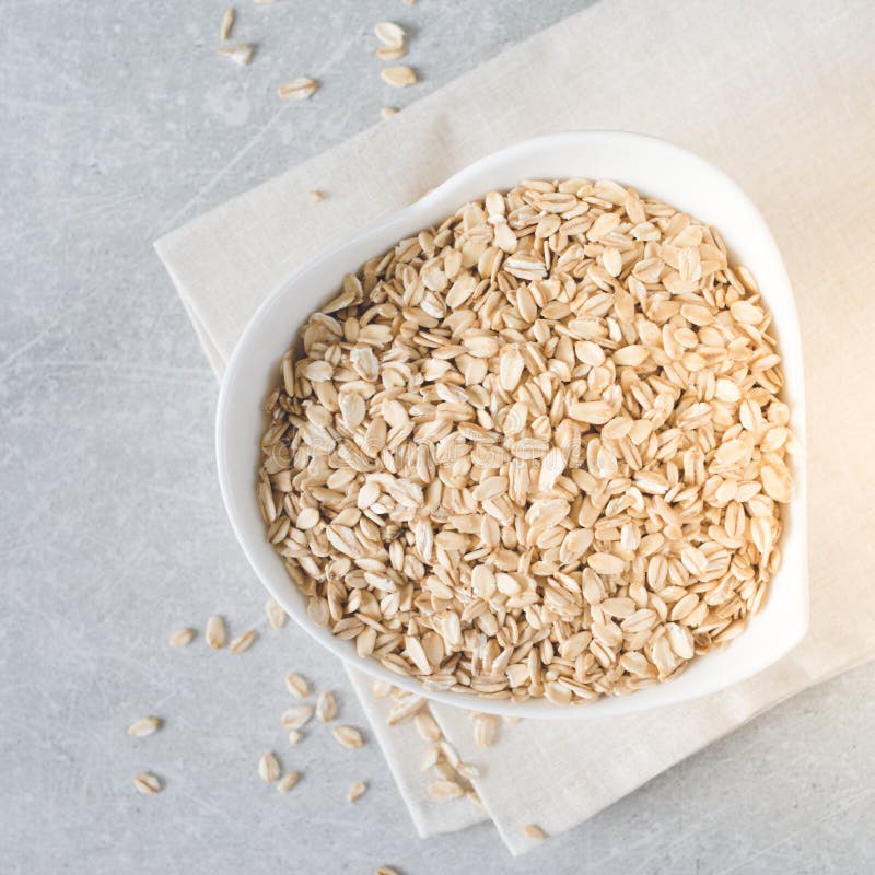 Food. Dry Rolled Oat Flakes Oatmeal on Bowl. Healthy Eating Concept ...