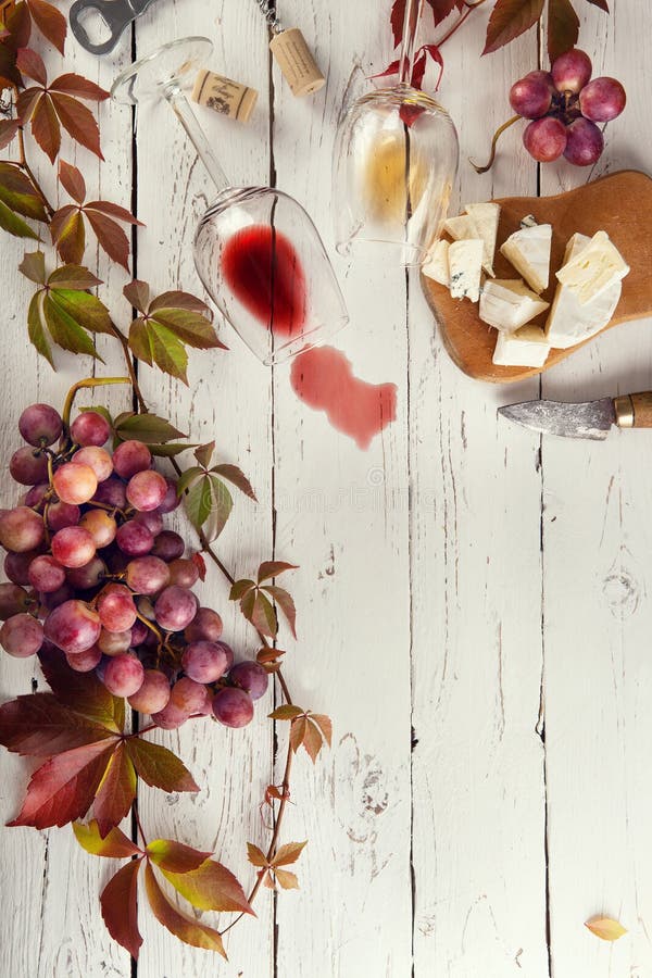 Food frame with wine, grapes and cheese