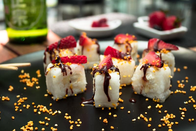 Japanese cuisine served on a black plate with food and beverage on the background. stock images Japanese cuisine served on a black plate with food and beverage on the background. stock images