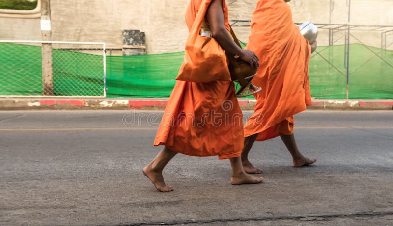Food offering to a monk. In the morning and walk as a couple and have lots of different people, waiting to make merit stock photography Food offering to a monk. In the morning and walk as a couple and have lots of different people, waiting to make merit stock photography