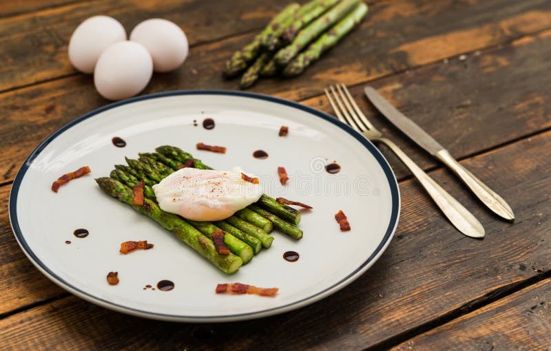 Food Photography of a Poached Egg with Asparagus, and Crispy Bacon