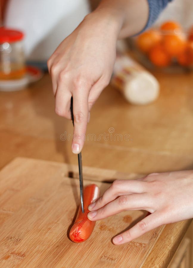 Food Preparation Cutting a Sausage Stock Photo Image of chopping