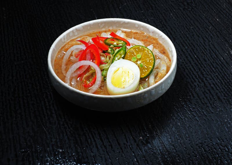 A food prsentation of a local dish,Laksa