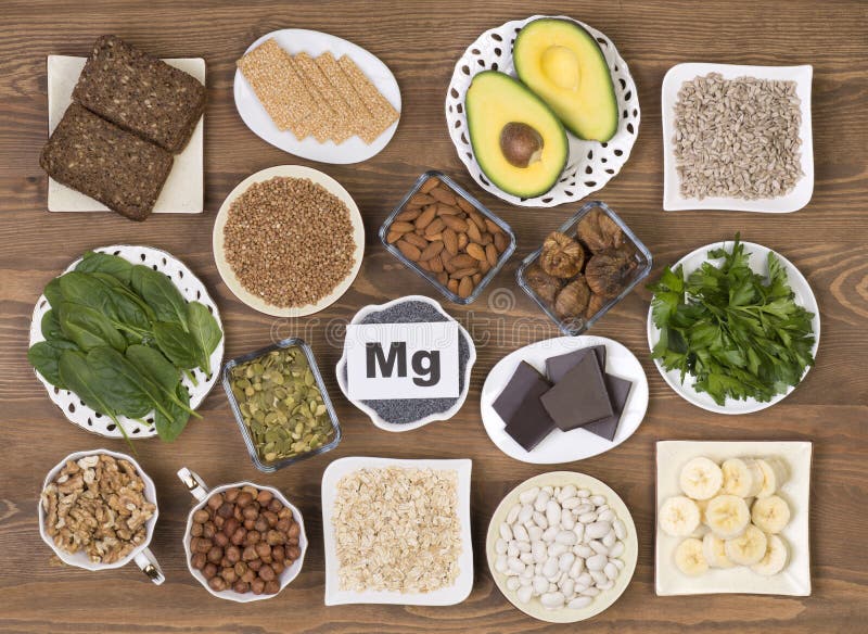 Food sources of magnesium. Such as pumpkin seeds, poppy seed, beans, chocolate, almonds, sunflower seeds, oatmeal, buckwheat, hazelnuts, sesame bars, figs royalty free stock photography