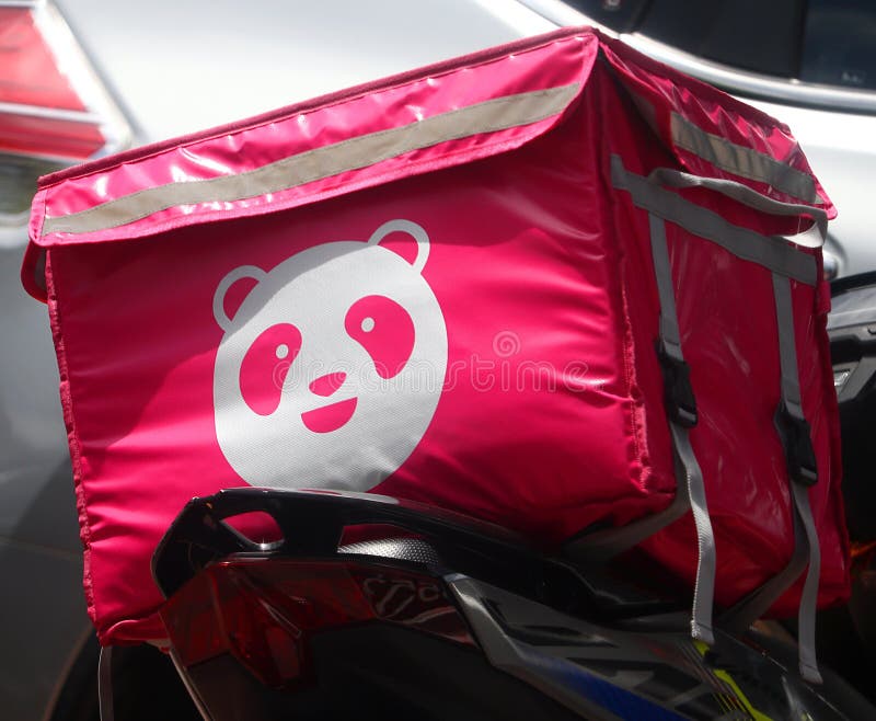 Foodpanda logo on a delivery rider`s container bag at the back of a motorbike in Malaysia. Foodpanda logo on a delivery rider`s container bag at the back of a motorbike in Malaysia