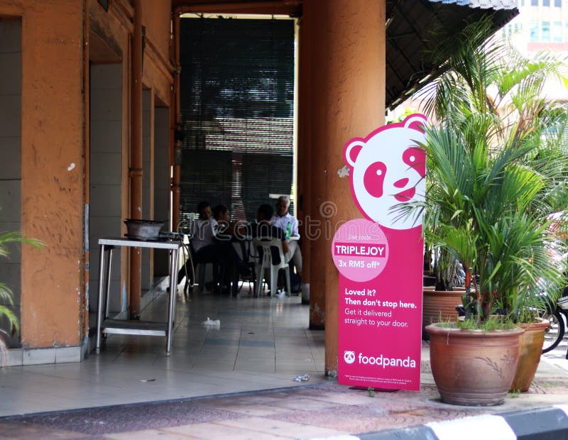 Foodpanda promotional signboard placed at the five-foot-way of a local Muslim restaurant in Ipoh Malaysia. The location of the signboard has been chosen to provide maximum publicity. Foodpanda promotional signboard placed at the five-foot-way of a local Muslim restaurant in Ipoh Malaysia. The location of the signboard has been chosen to provide maximum publicity