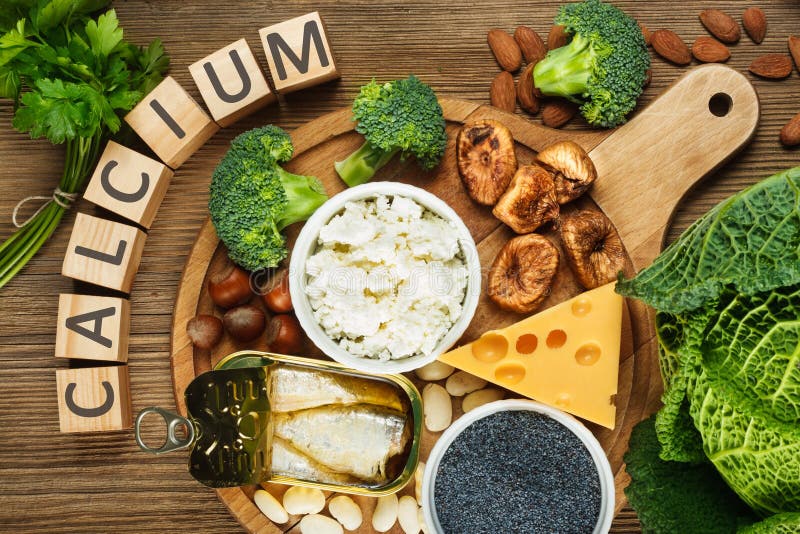 Foods rich in calcium. Such as sardines, bean, dried figs, almonds, cottage cheese, hazelnuts, parsley leaves, blue poppy seed, broccoli, italian cabbage royalty free stock photo