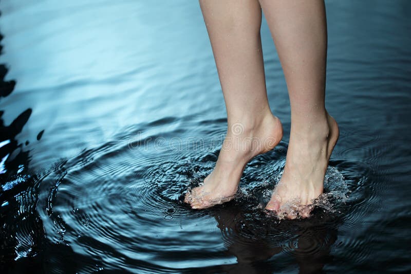 Foot in blue water