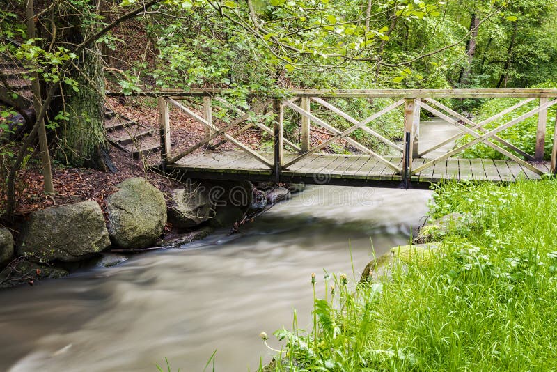 Foot bridge over creek stock photo. Image of crossing 78920044