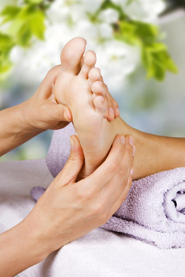 Foot massage in the spa salon