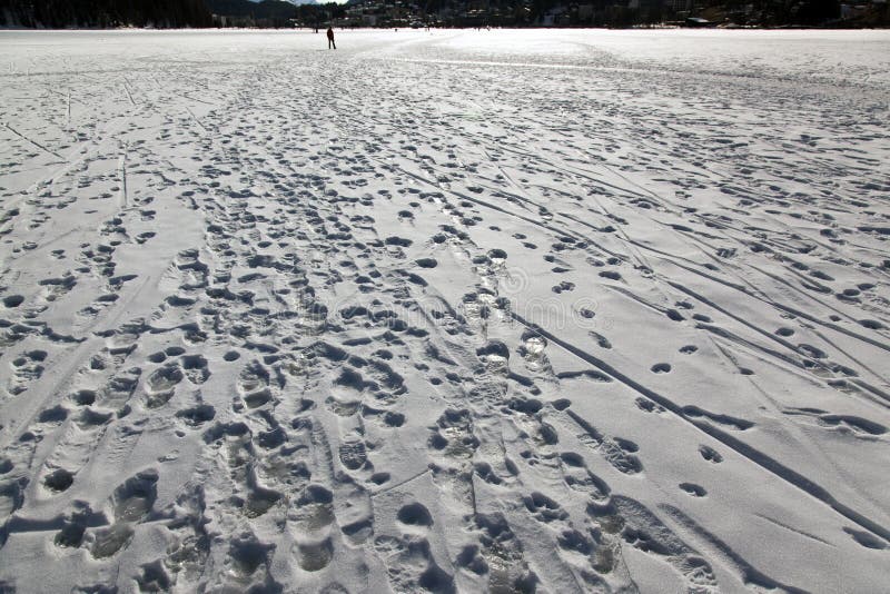 Foot print marks and traces in the snow covered landscape in St Moritz Switzerland