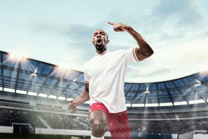 Football Soccer Player is Number One in a Stadium Background Stock