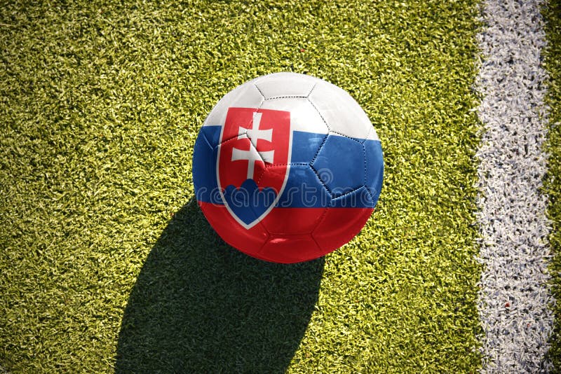 Football ball with the national flag of slovakia lies on the field