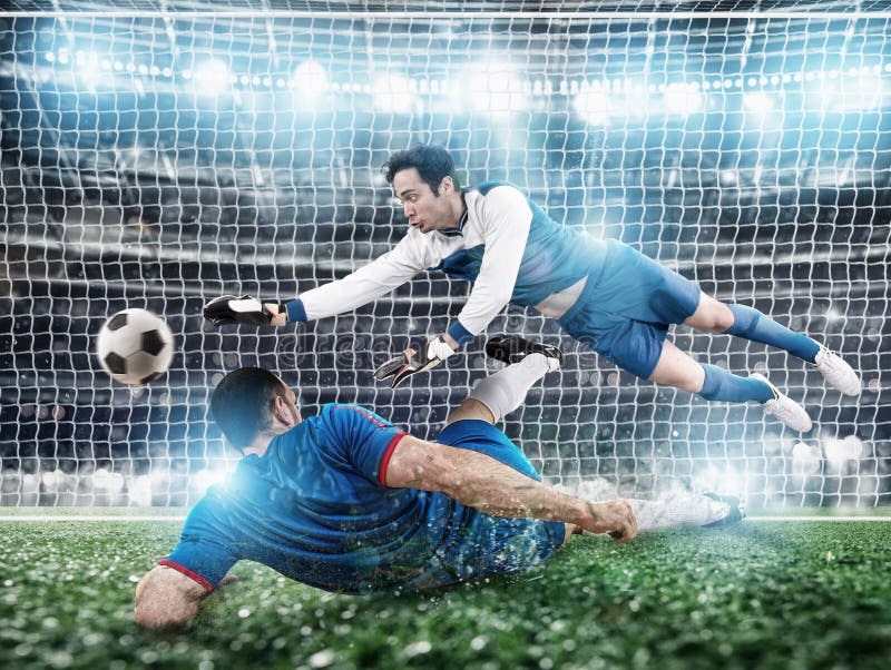 Goalkeeper catches the ball in the stadium during a football game. stock photo Goalkeeper catches the ball in the stadium during a football game. stock photo