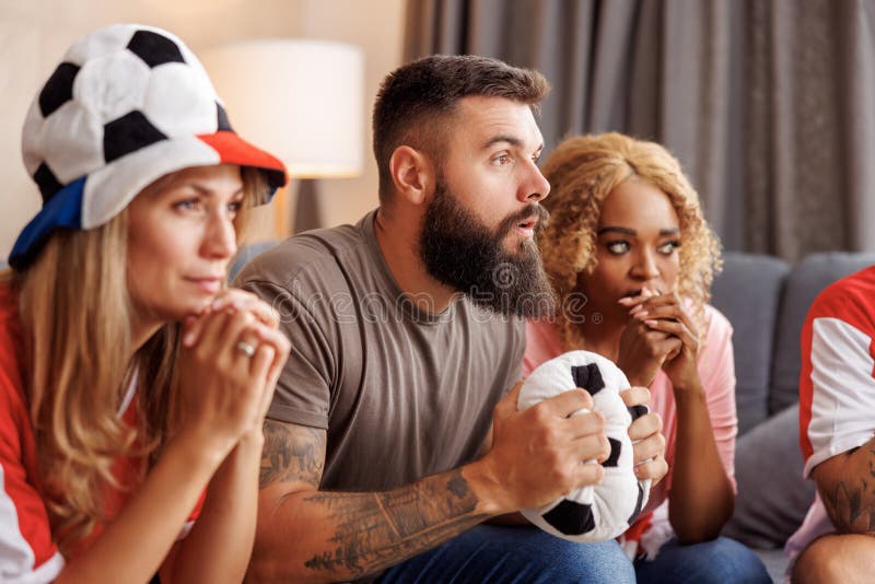 Football Fans Serious While Watching The Game On TV Stock Image Image is-there-a-thursday-night-football-game-tonight-nfl-schedule-tv