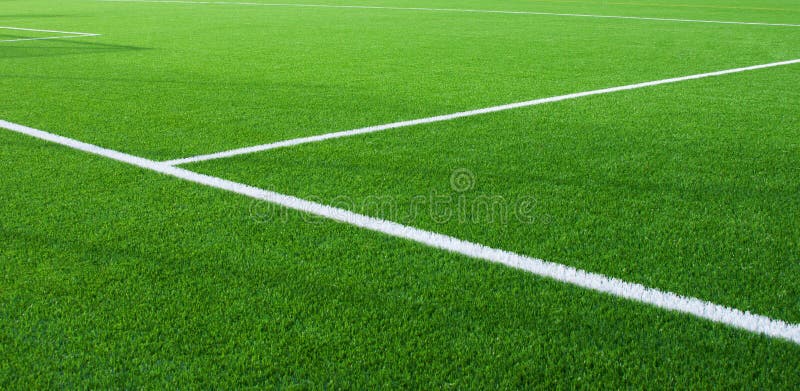 Football field fragment close up white lines. Football field fragment close up white lines