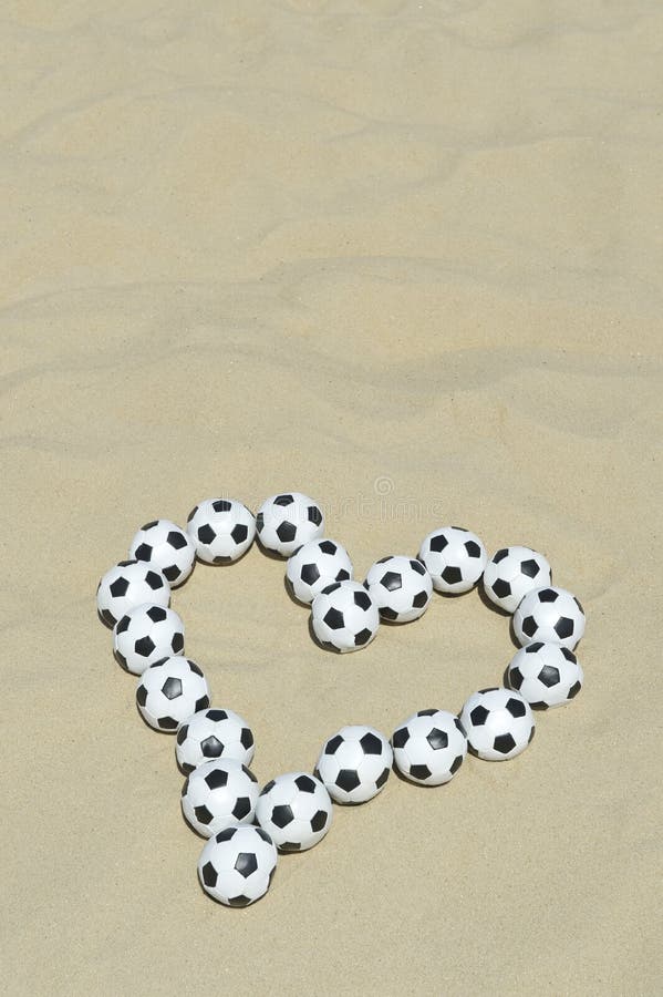 Football Love Heart Made with Soccer Balls on Beach royalty free stock photos Football Love Heart Made with Soccer Balls on Beach royalty free stock photos