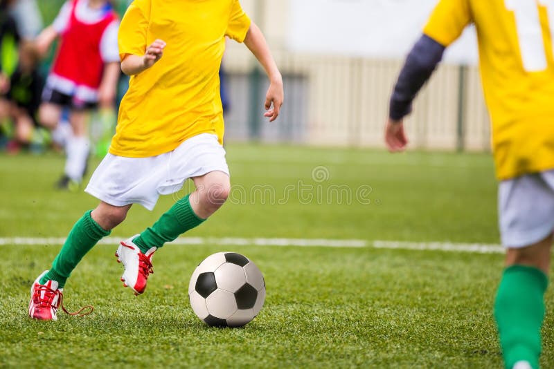 Football game for kids children. Boys playing football