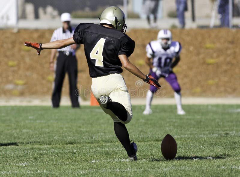 Football Player Kicking a Ball royalty free stock photo
