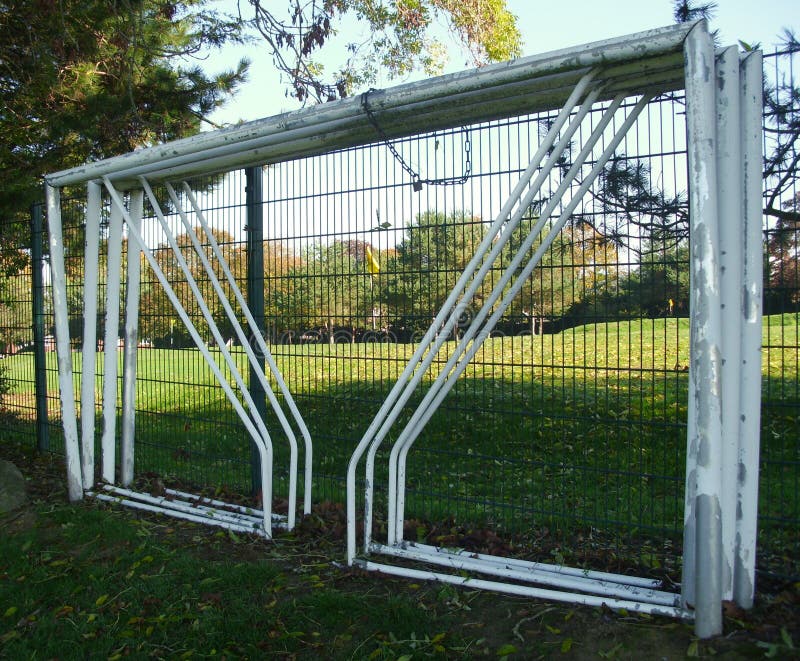 Football Soccer Goalposts, Chained to a Fence in a Public Park stock photos Football Soccer Goalposts, Chained to a Fence in a Public Park stock photos