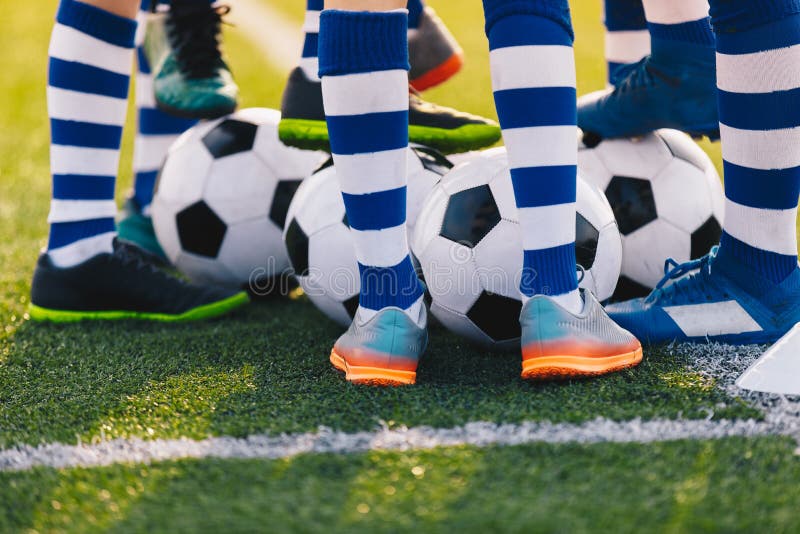 Football Training. Legs of Young Soccer Boys. Football Academy Team Training with Balls royalty free stock image Football Training. Legs of Young Soccer Boys. Football Academy Team Training with Balls royalty free stock image