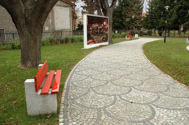 Footpath bench and painting in park