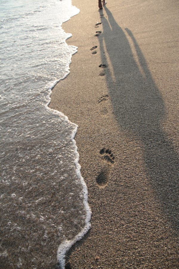 Shadow And Footprints On A Beach Stock Image - Image of tide, holiday ...