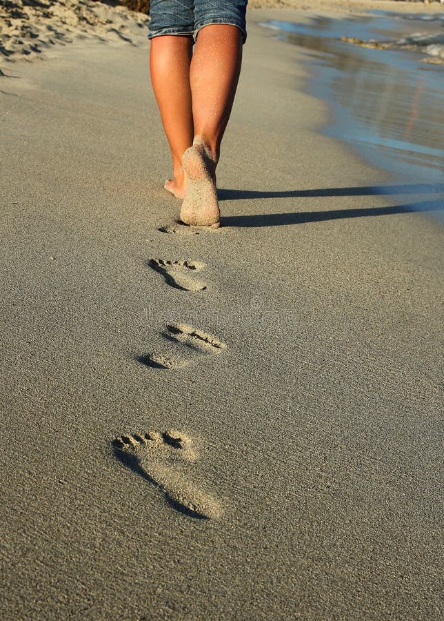 Footprints in the sand stock image. Image of idyllic 74657119
