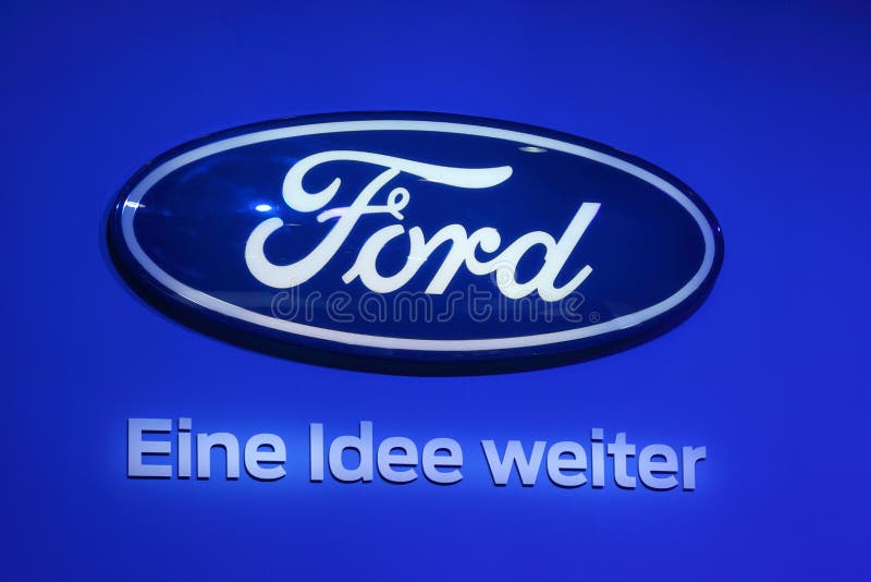 Ford Company Logo. LEIPZIG, GERMANY - JUNE 1: Ford Logo and motto - Eine Idee weiter (an idea forward) at the AMI - Auto Mobile International Trade Fair on June royalty free stock image Ford Company Logo. LEIPZIG, GERMANY - JUNE 1: Ford Logo and motto - Eine Idee weiter (an idea forward) at the AMI - Auto Mobile International Trade Fair on June royalty free stock image