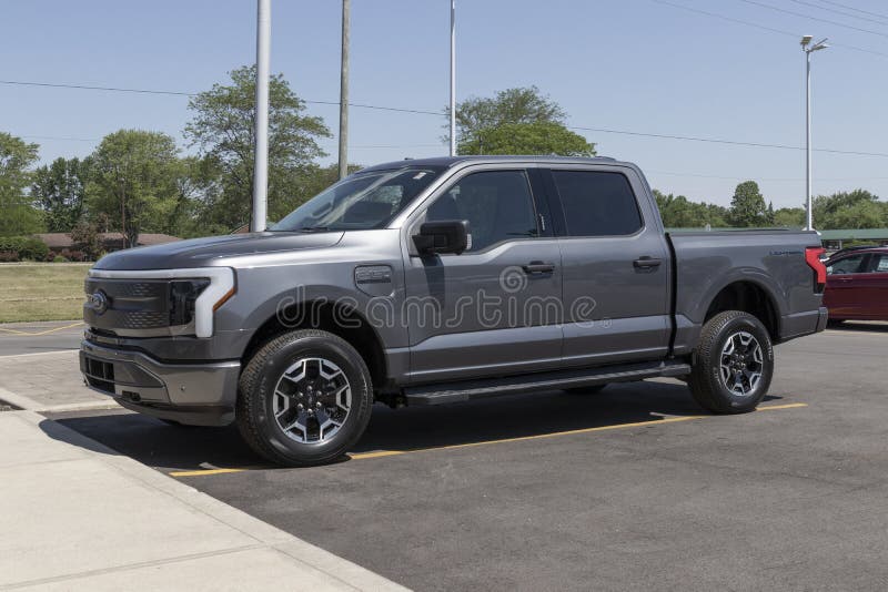 Marion - Circa June 2022: Ford F-150 Lightning display. Ford offers the F150 Lightning all-electric truck in Pro, XLT, Lariat, and Platinum models. Marion - Circa June 2022: Ford F-150 Lightning display. Ford offers the F150 Lightning all-electric truck in Pro, XLT, Lariat, and Platinum models