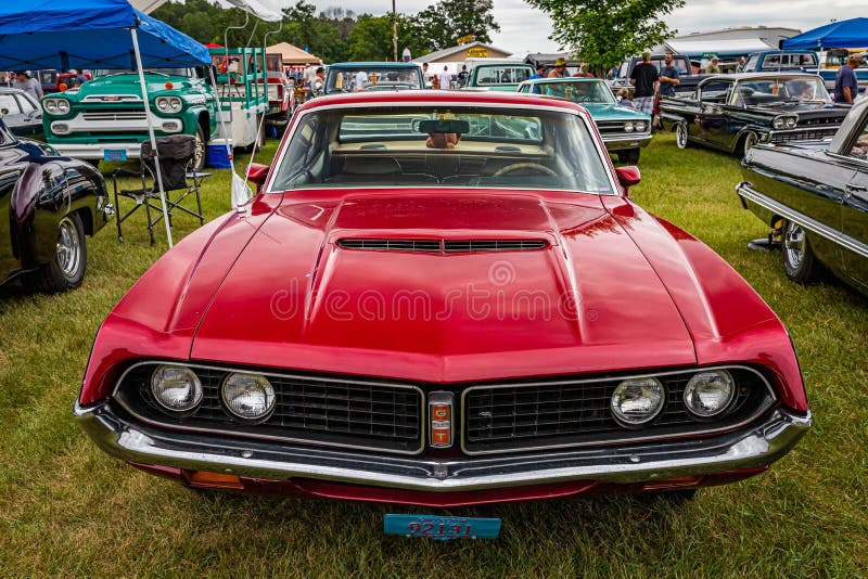 Iola, WI - July 07, 2022: High perspective front view of a 1971 Ford Torino 500 2 Door Hardtop at a local car show. Iola, WI - July 07, 2022: High perspective front view of a 1971 Ford Torino 500 2 Door Hardtop at a local car show