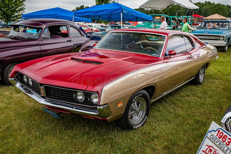 Iola, WI - July 07, 2022: High perspective front corner view of a 1971 Ford Torino 500 2 Door Hardtop at a local car show. Iola, WI - July 07, 2022: High perspective front corner view of a 1971 Ford Torino 500 2 Door Hardtop at a local car show