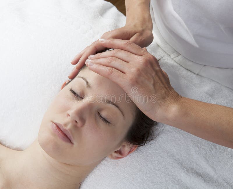 Forehead massage to remove migraine stock image