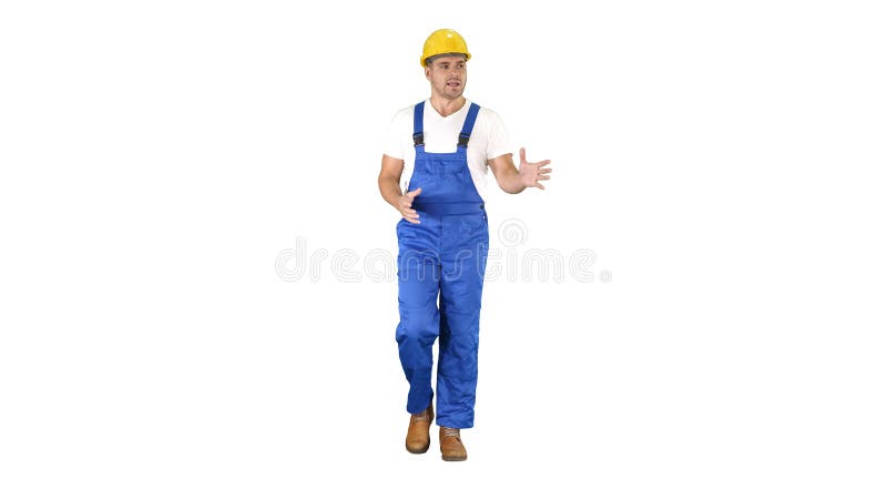 Foreman builder explaining something to camera and talking on white background. royalty free stock photo