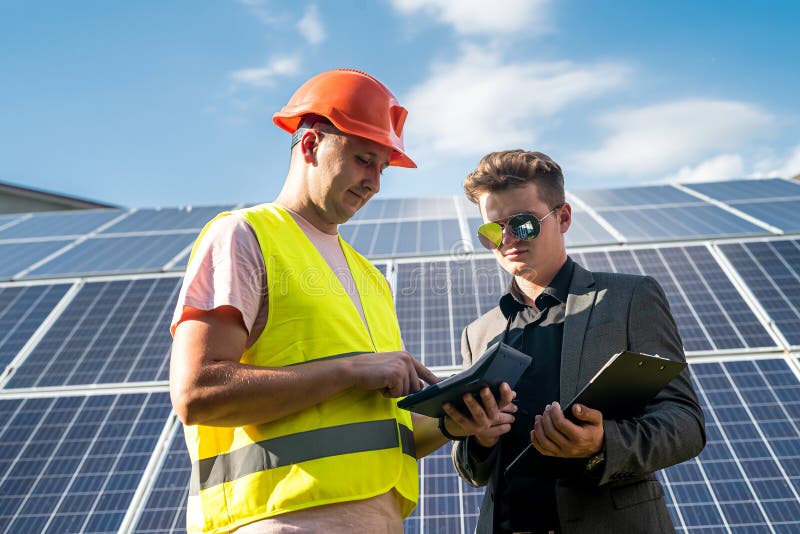 Foreman and Engineer Work during Checking and Repairing Solar Photovoltaic Panel Stock Image
