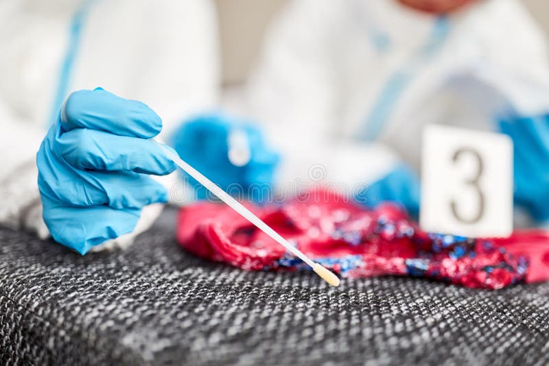 Forensic scientists take DNA sample