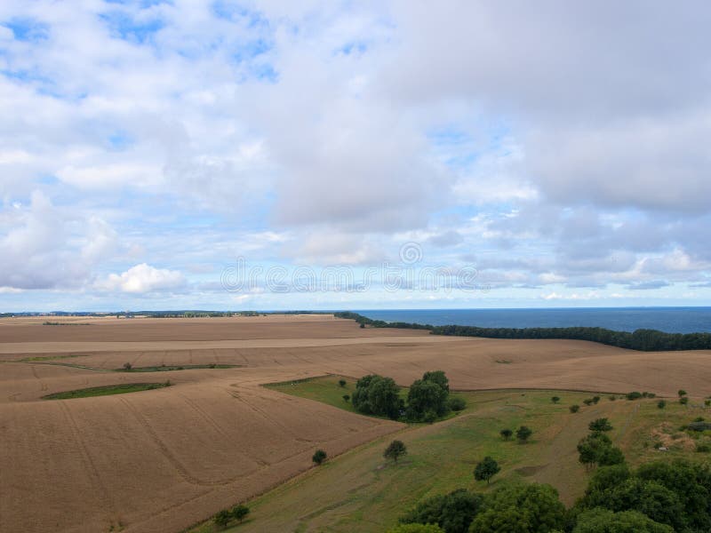 Foresight over fields under a blue sky. Foresight over fields under a blue sky