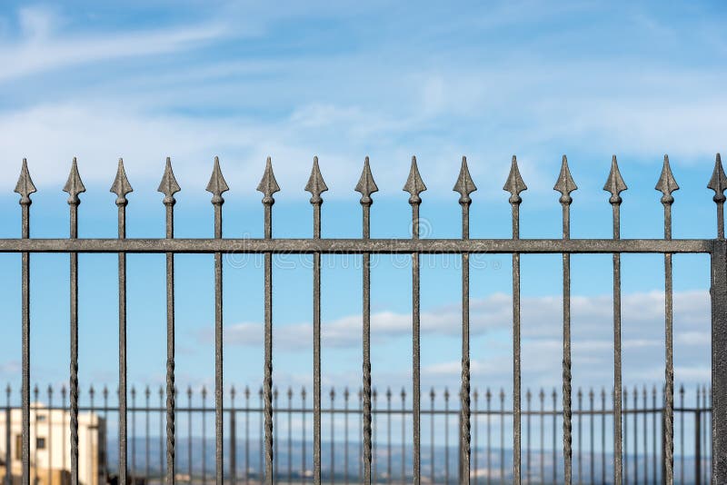 Forged iron fence with arrows