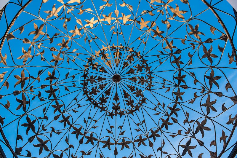 Forged metal pattern on the blue background stock image