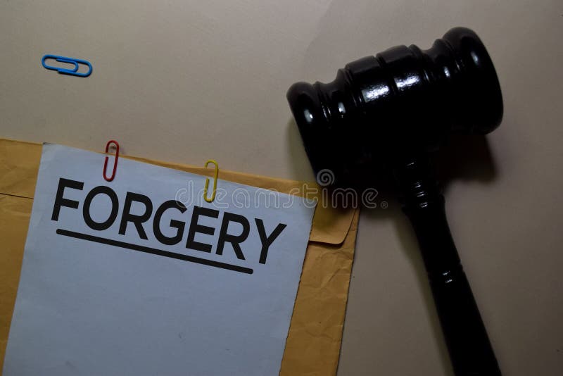 Forgery text on document above brown envelope and judges gavel. Justice and Law Concept