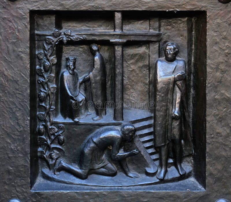 Forgive us our debts - the parable of the unforgiving servant, relief on the door of the Grossmunster church in Zurich