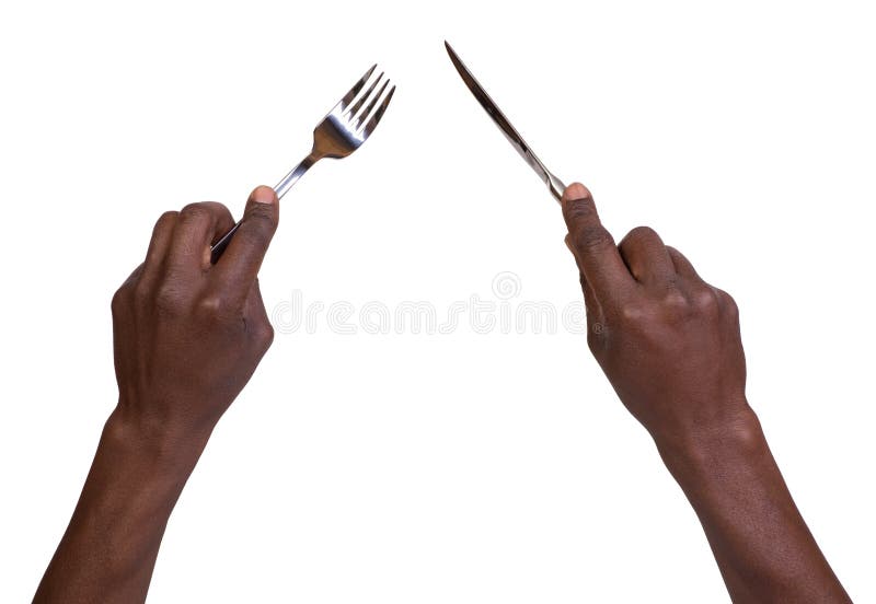 Fork and knife being held by mans hands stock photo