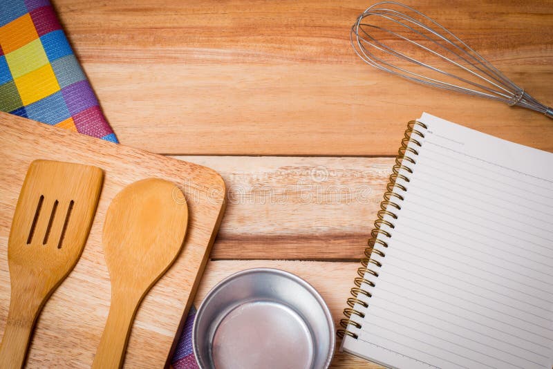 Fork, Knife,book diary and Table Cloth on wooden background. stock photography