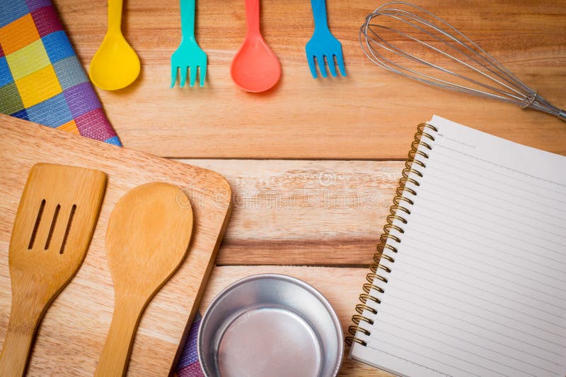 Fork, Knife,notebook diary and Table Cloth on wooden background. Top royalty free stock image