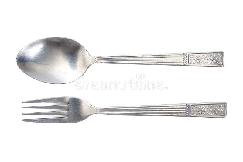 Silver spoon and fork isolated on white background. Silver spoon and fork carving flowers pattern handle isolated background